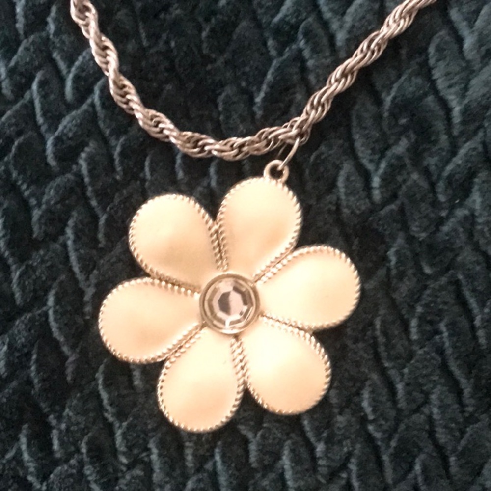 LC signed necklace with a cream color flower on a silver toned chain